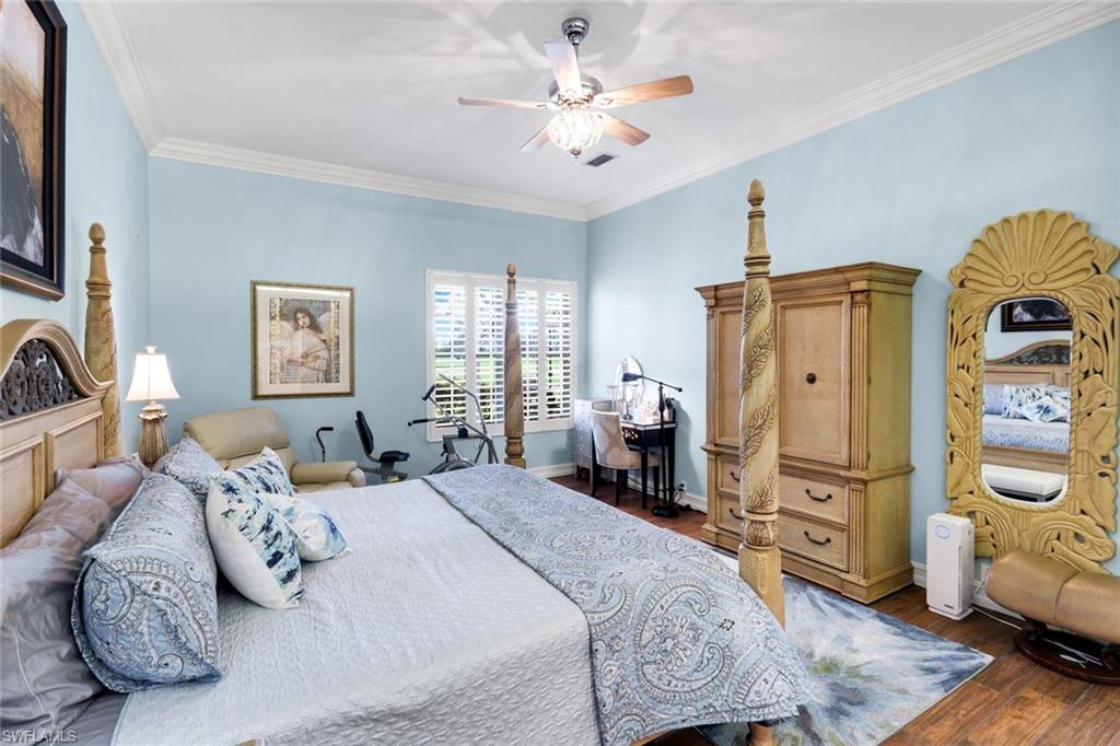 11426 Quail Village Way Naples, FL 34119 - Photo 15 of 46 a bedroom with bed and a window