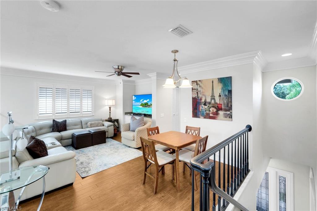 11426 Quail Village Way Naples, FL 34119 - Photo 21 of 46 a view of a livingroom with furniture and window
