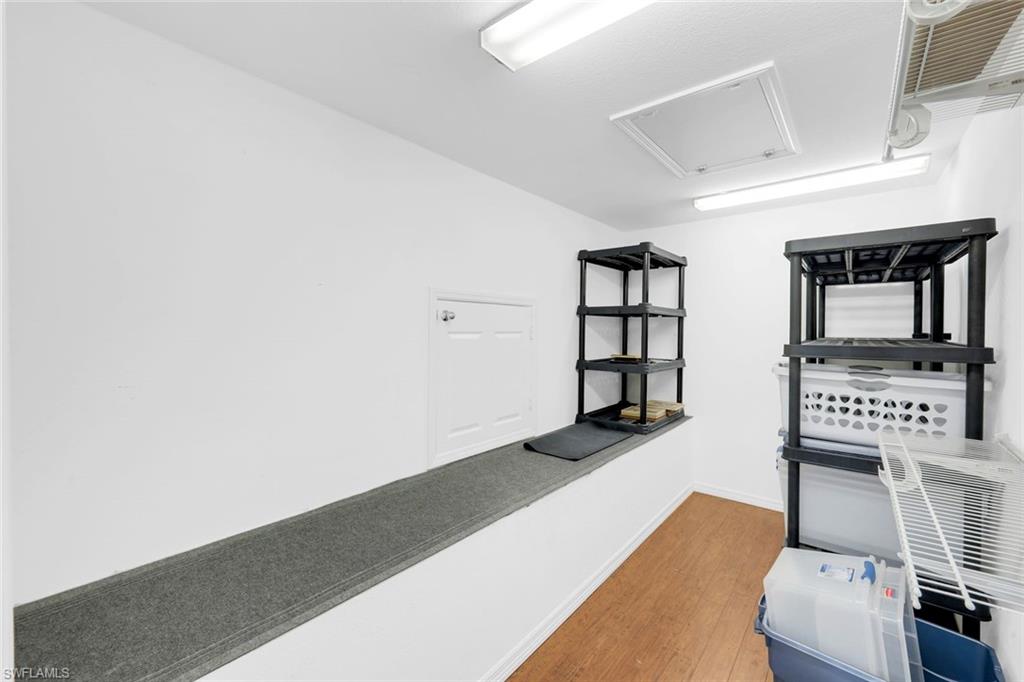 11426 Quail Village Way Naples, FL 34119 - Photo 27 of 46 a view of a livingroom with furniture and window