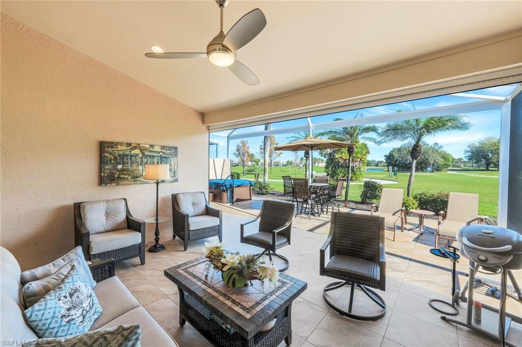 11426 Quail Village Way Naples, FL 34119 - Photo 31 of 46 a living room with furniture and a large window