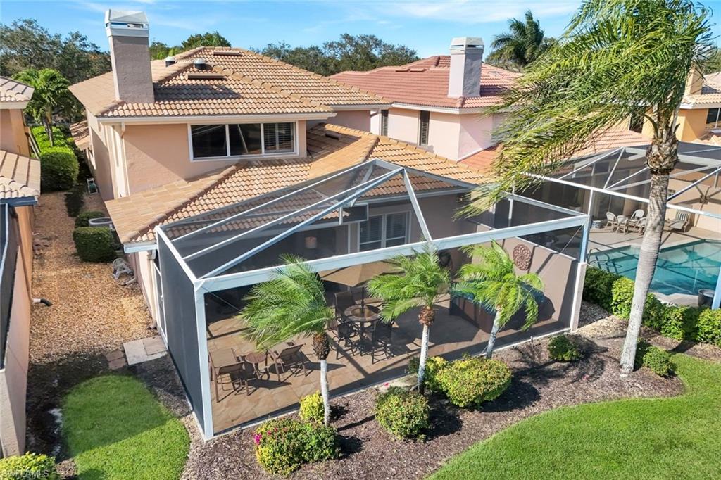 11426 Quail Village Way Naples, FL 34119 - Photo 32 of 46 a view of a house with a yard and plants