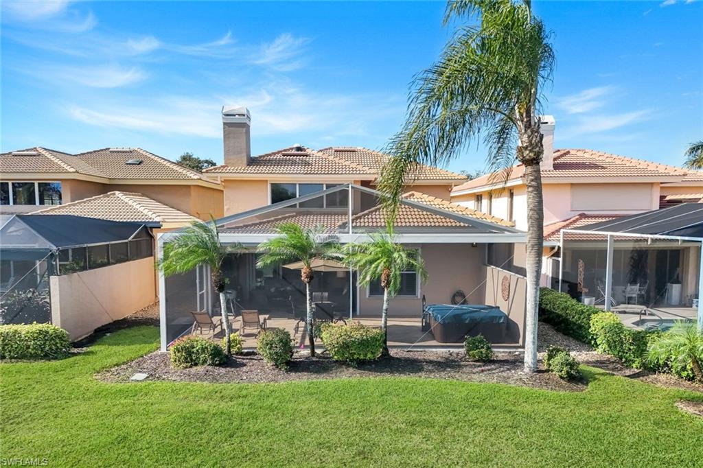 11426 Quail Village Way Naples, FL 34119 - Photo 33 of 46 a view of a house with a yard and sitting area