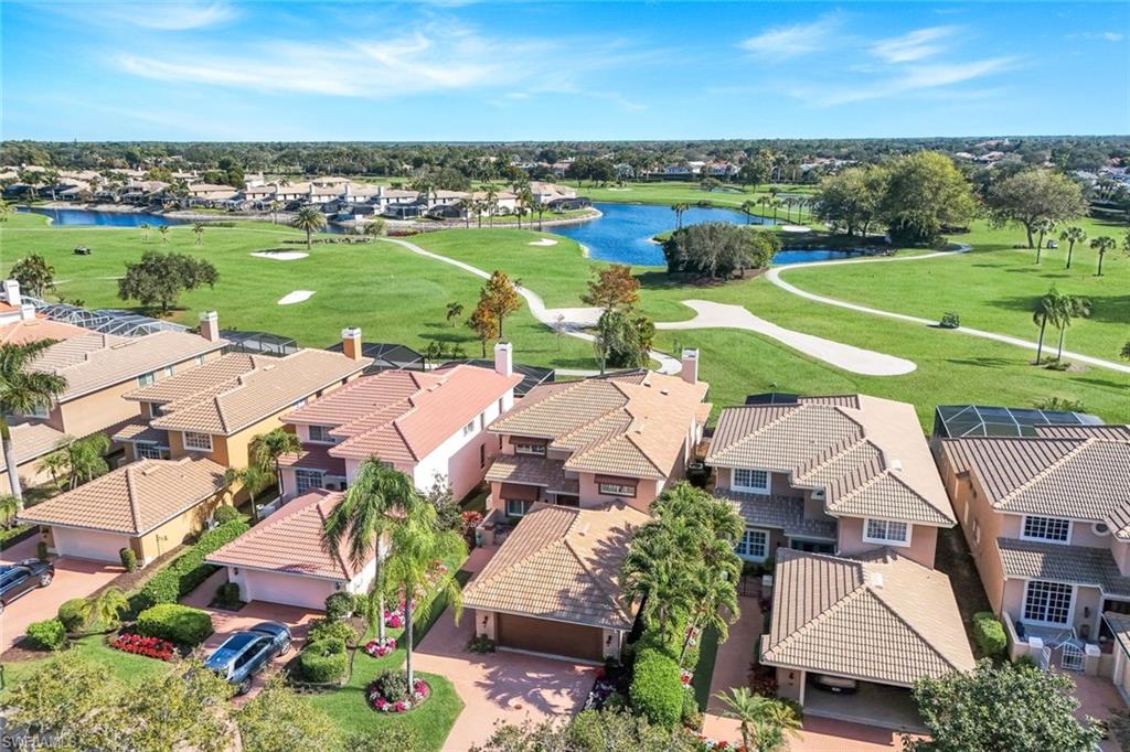 11426 Quail Village Way Naples, FL 34119 - Photo 35 of 46 an aerial view of a houses with outdoor space and mountain view in back