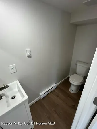 a bathroom with a toilet and a sink