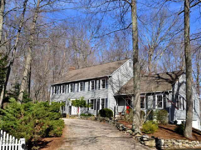 20 Peaceable Ridge Road Ridgefield, CT 06877 - Photo 1 of 1 a front view of a building with garden