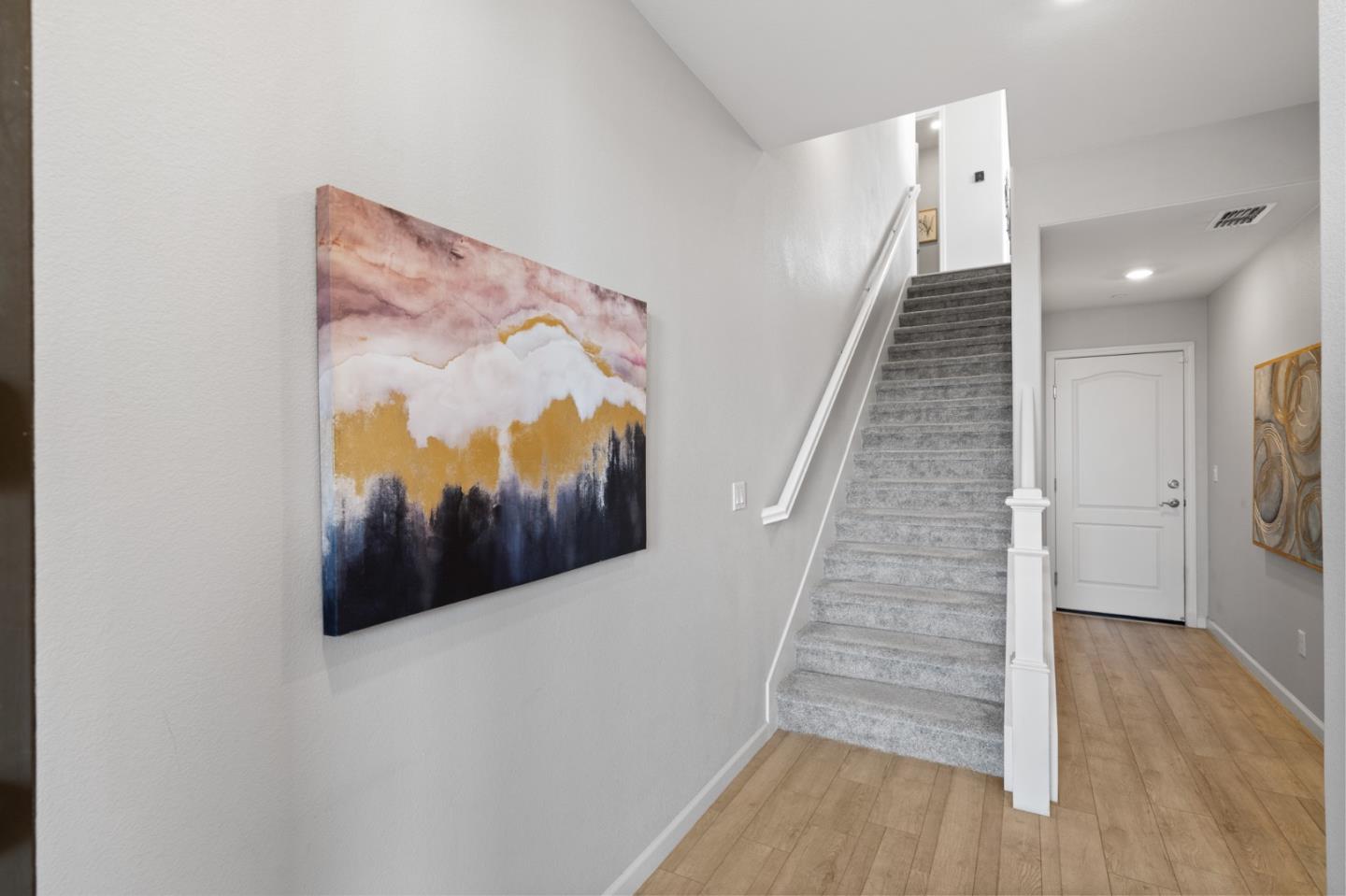 495 Snap Dragon Street Milpitas, CA 95035 - Photo 15 of 33 a view of a hallway with wooden floor and stairs