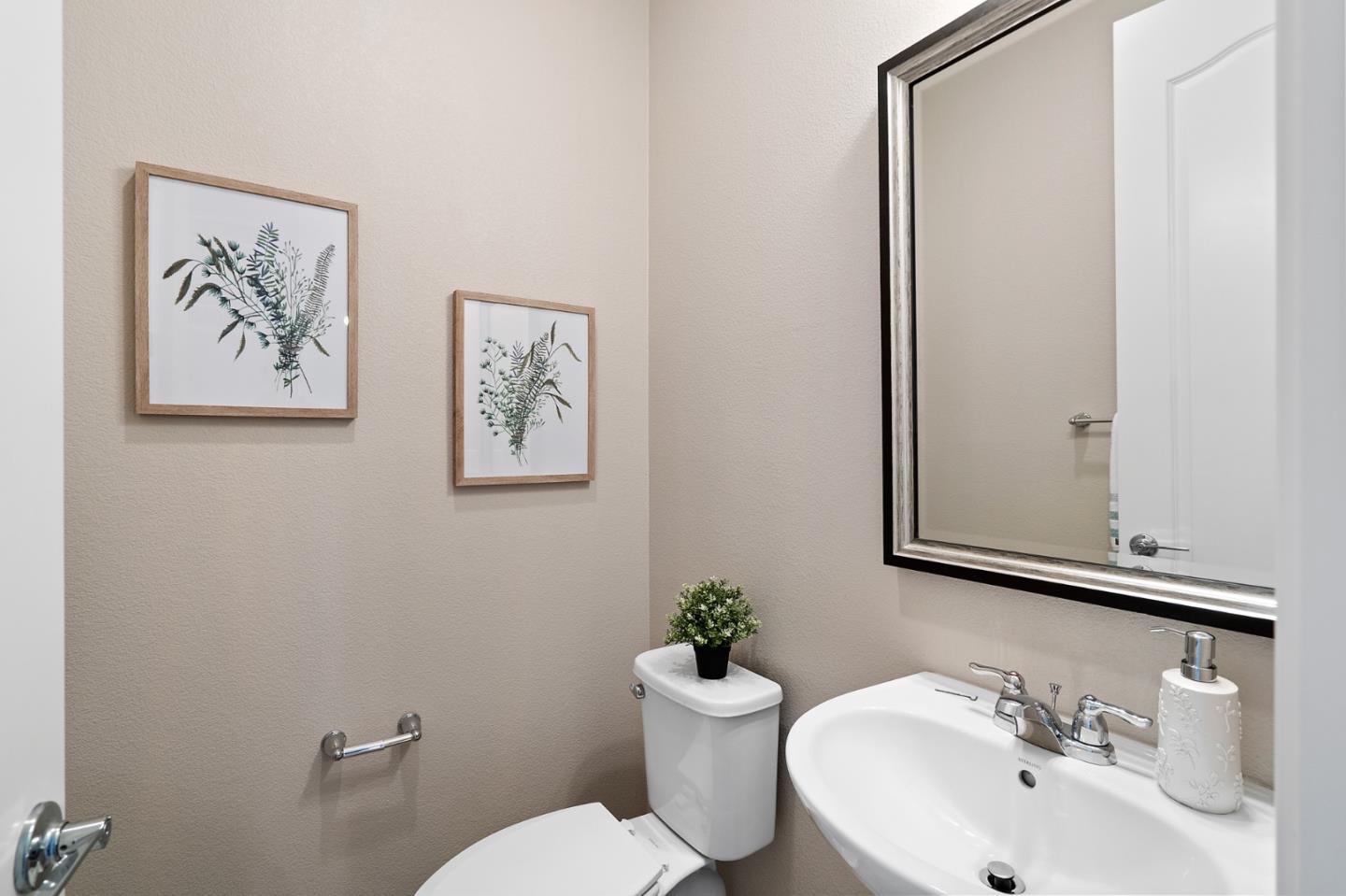 495 Snap Dragon Street Milpitas, CA 95035 - Photo 24 of 33 a bathroom with a toilet a sink and mirror