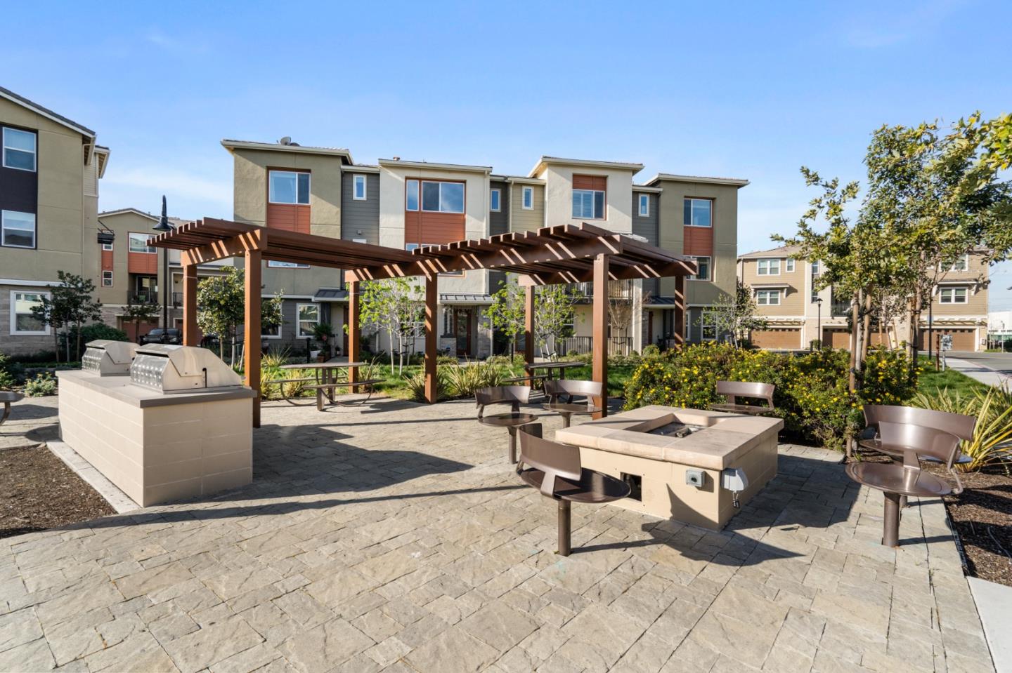 495 Snap Dragon Street Milpitas, CA 95035 - Photo 31 of 33 a building outdoor space with patio furniture and potted plants