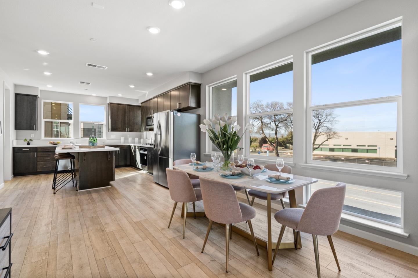 495 Snap Dragon Street Milpitas, CA 95035 - Photo 10 of 33 a kitchen with a table chairs refrigerator and microwave