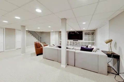 a view of a house with a bed and wooden floor