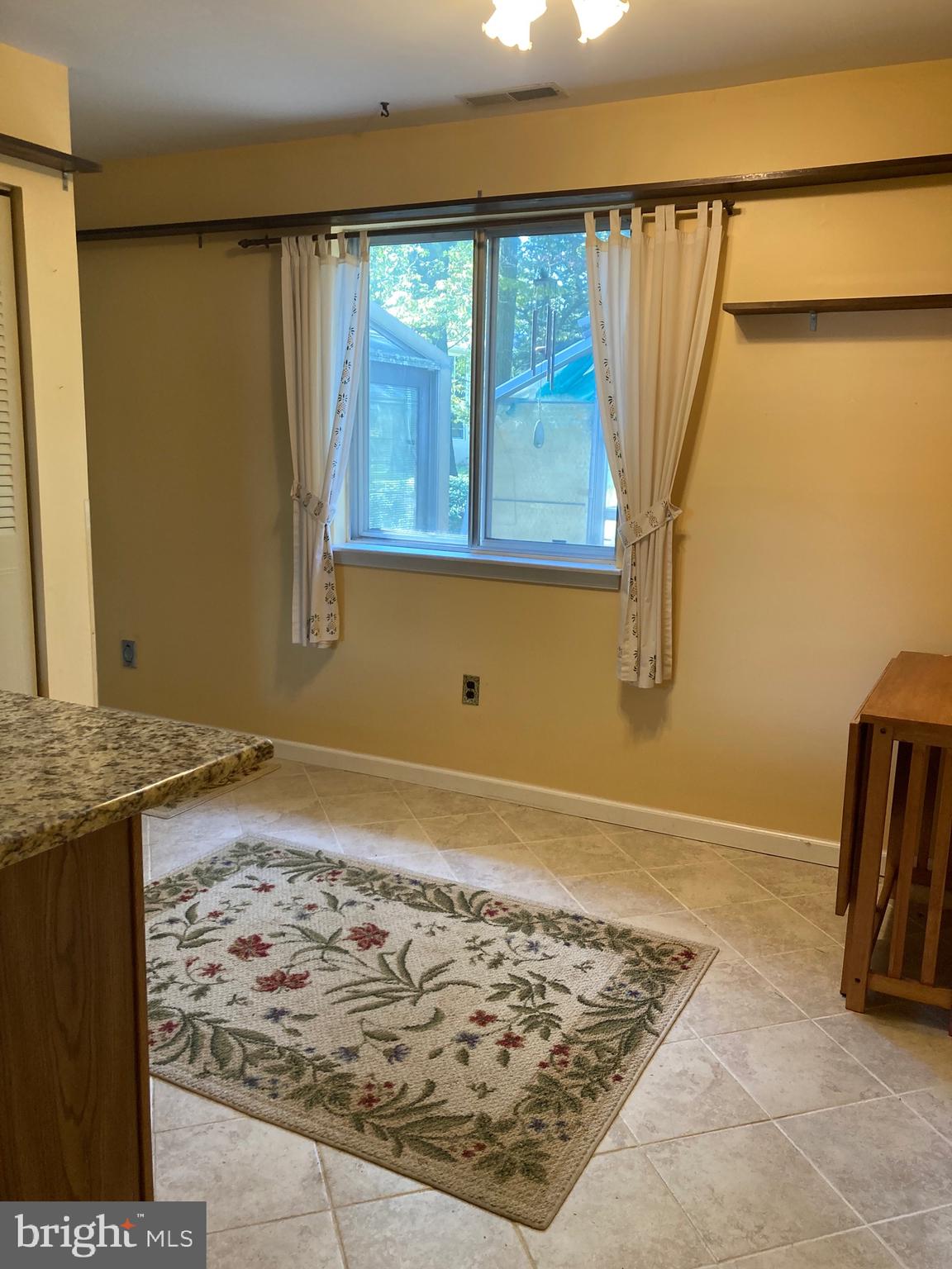 421 Lakeview Terrace Pemberton, NJ 08068 - Photo 14 of 23 a view of a kitchen with wooden floor and a window