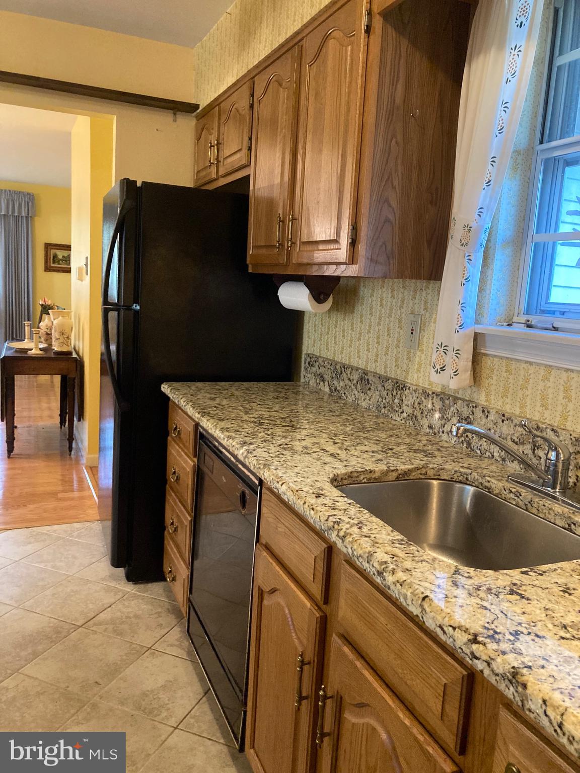 421 Lakeview Terrace Pemberton, NJ 08068 - Photo 5 of 23 a kitchen with granite countertop a refrigerator and a sink