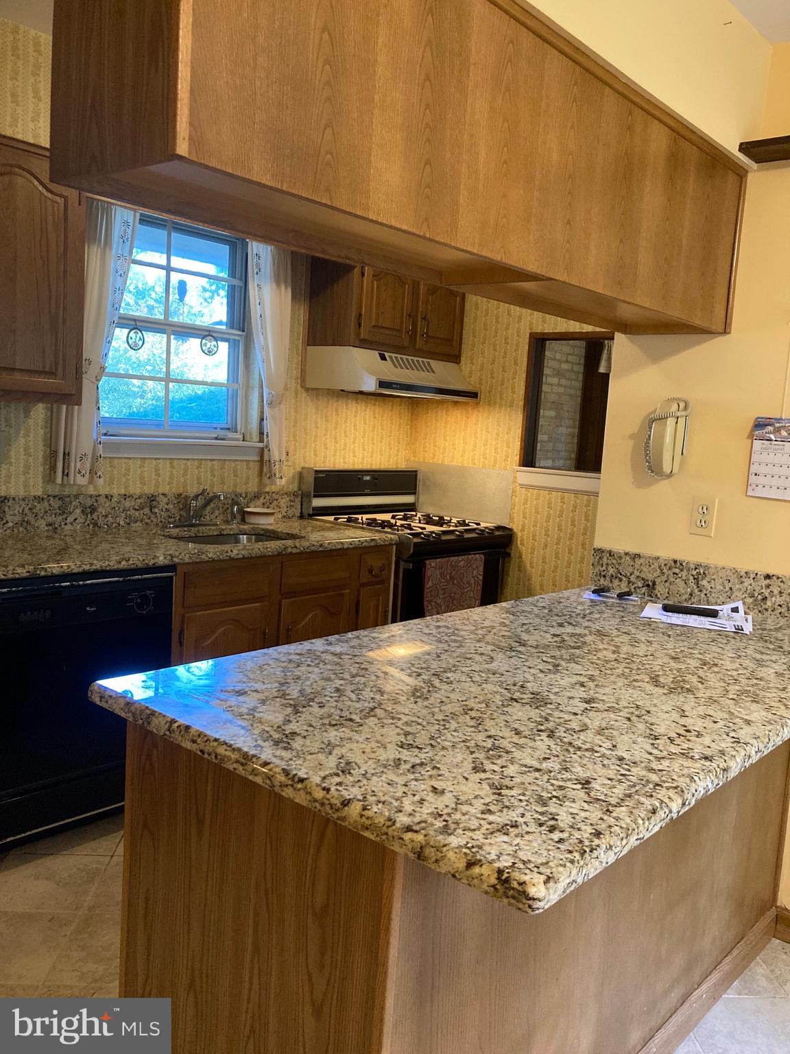 421 Lakeview Terrace Pemberton, NJ 08068 - Photo 6 of 23 a kitchen with stainless steel appliances kitchen island granite countertop a sink stove and granite counter top