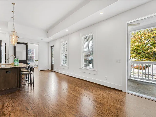a view of a livingroom with furniture window and wooden floor