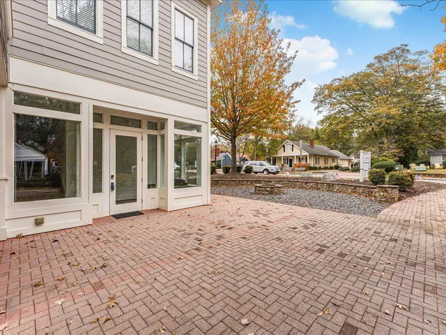 a view of a building with a snow on the side of the road