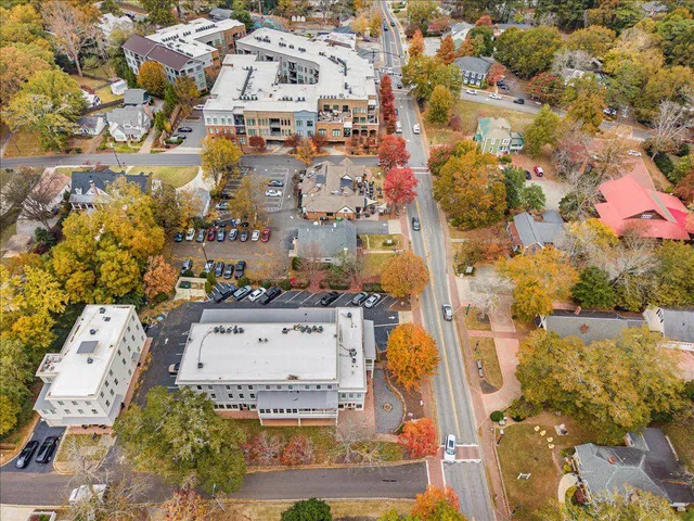 an aerial view of residential houses with outdoor space