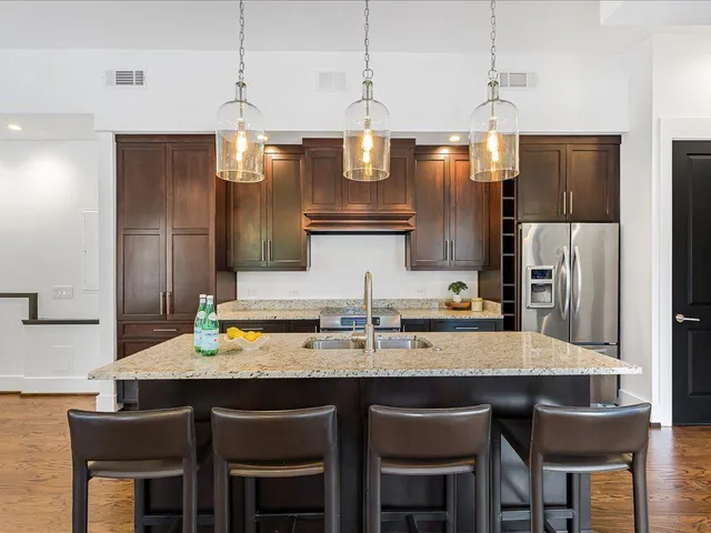 a kitchen with a counter space appliances and cabinets