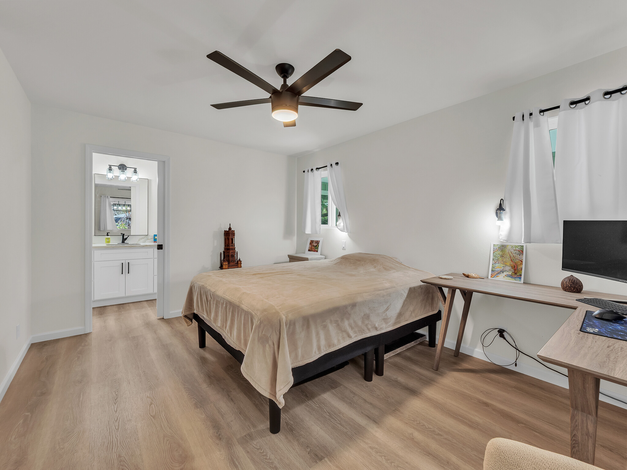 11-3976 Liona Street Volcano, HI 96785 - Photo 15 of 27 a bedroom with a bed and a chandelier