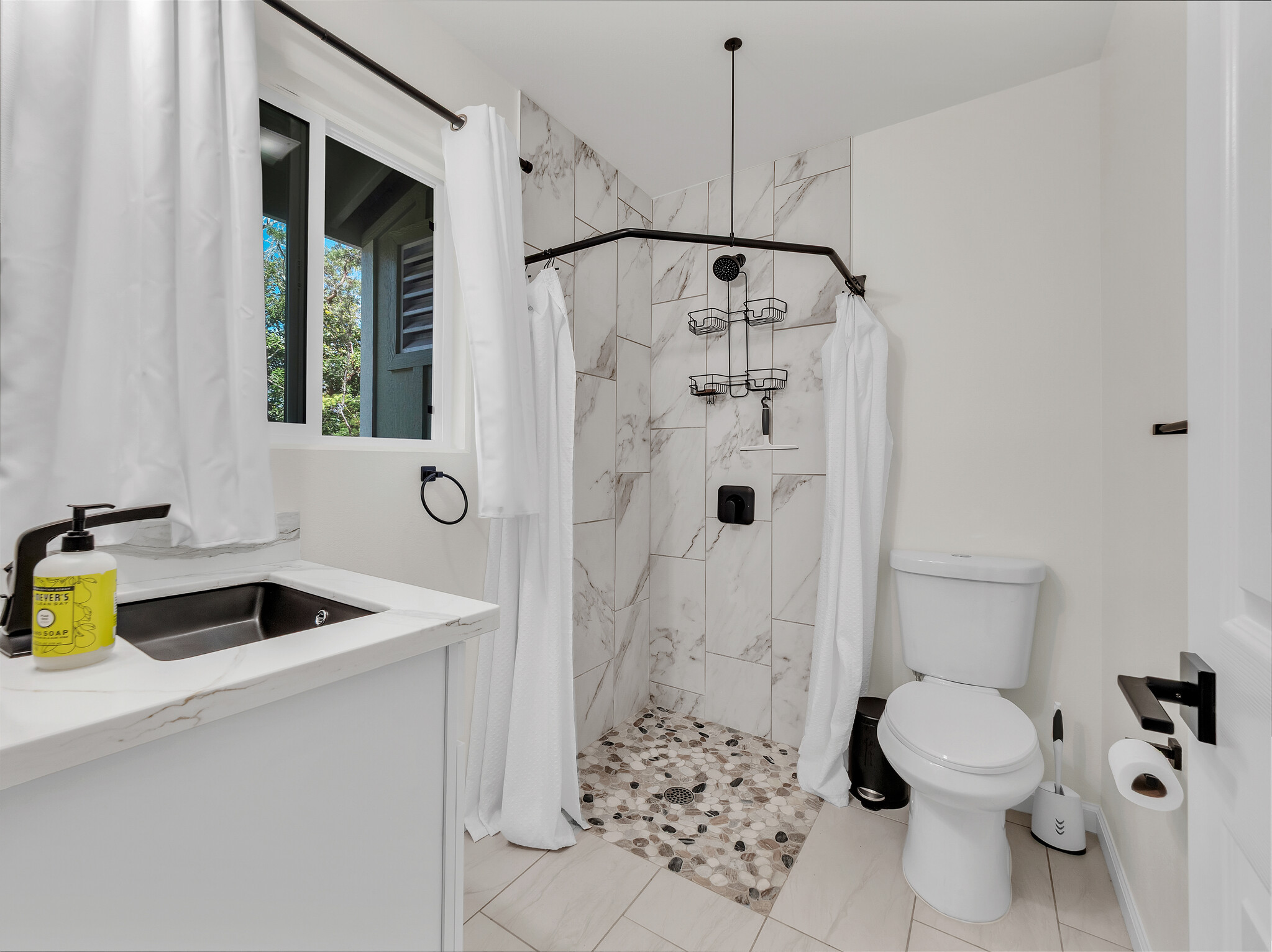 11-3976 Liona Street Volcano, HI 96785 - Photo 19 of 27 a bathroom with a granite countertop sink a toilet and shower