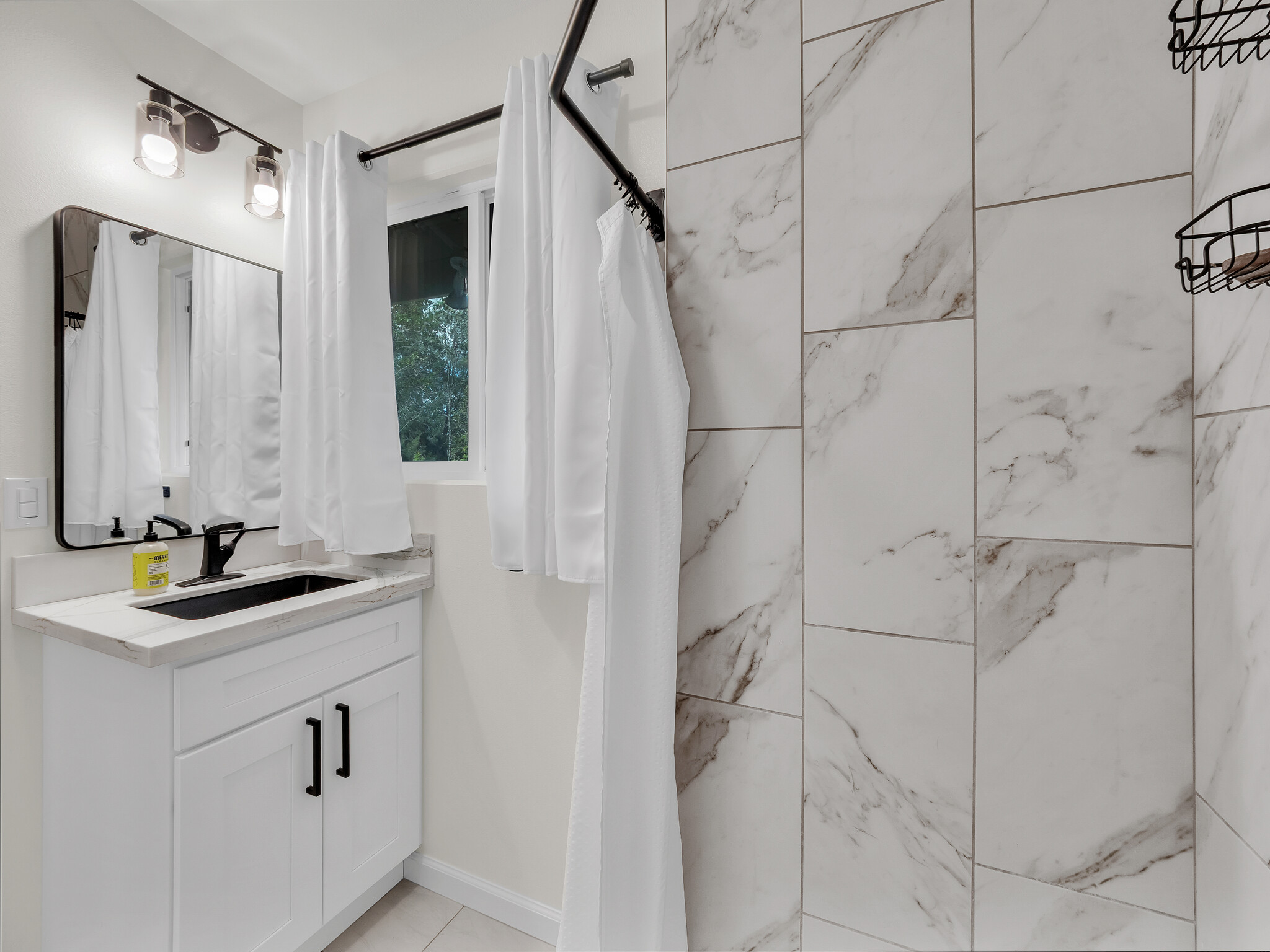 11-3976 Liona Street Volcano, HI 96785 - Photo 20 of 27 a bathroom with a sink and mirror