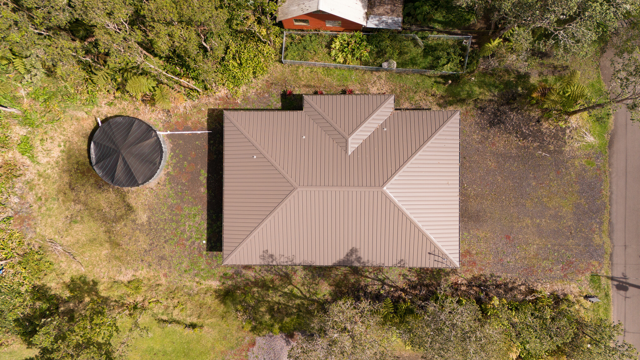 11-3976 Liona Street Volcano, HI 96785 - Photo 2 of 27 a view of a house with a backyard