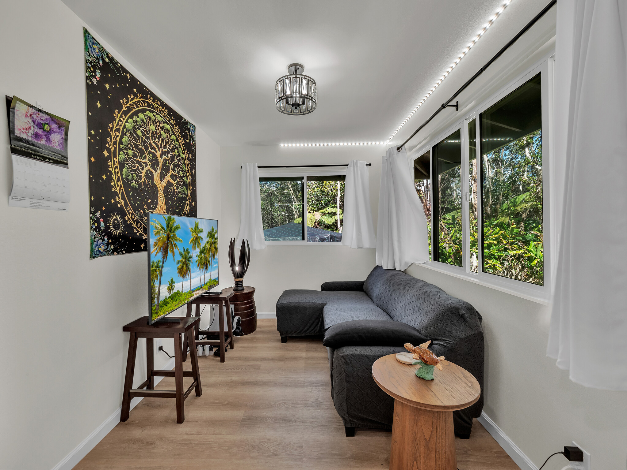 11-3976 Liona Street Volcano, HI 96785 - Photo 6 of 27 a living room with furniture and a large window