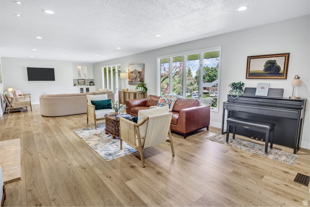 1350 Canyon Park Road Bountiful, UT 84010 - Photo 8 of 38 Expansive living area featuring light wood-finish flooring and recessed ceiling lights throughout