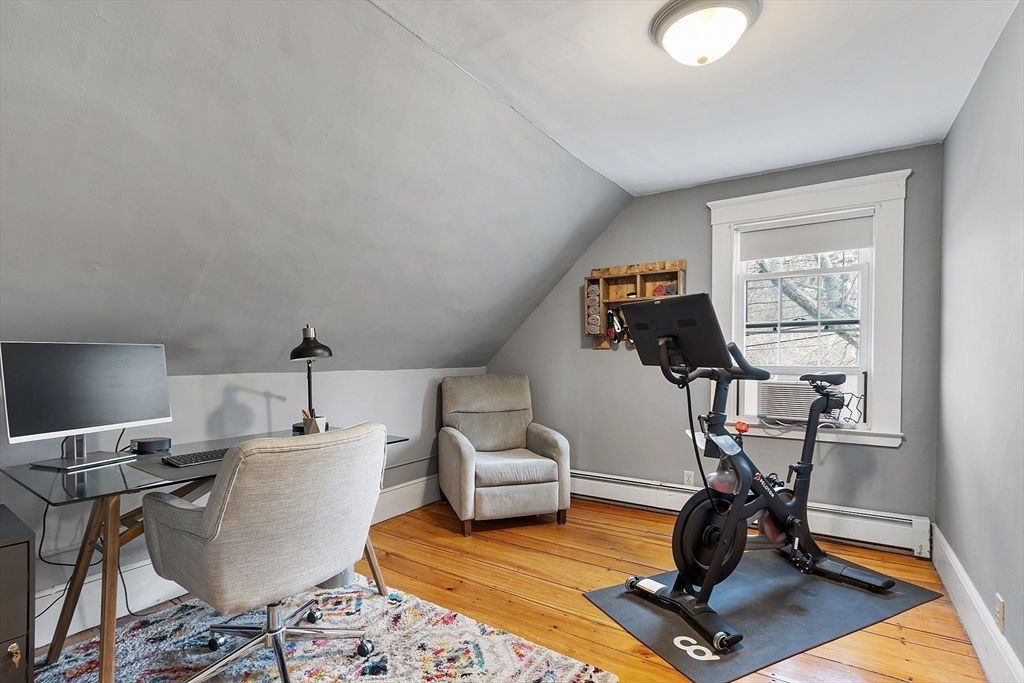 102 Centre Street Danvers, MA 01923 - Photo 12 of 36 a view of a workspace with furniture and a window