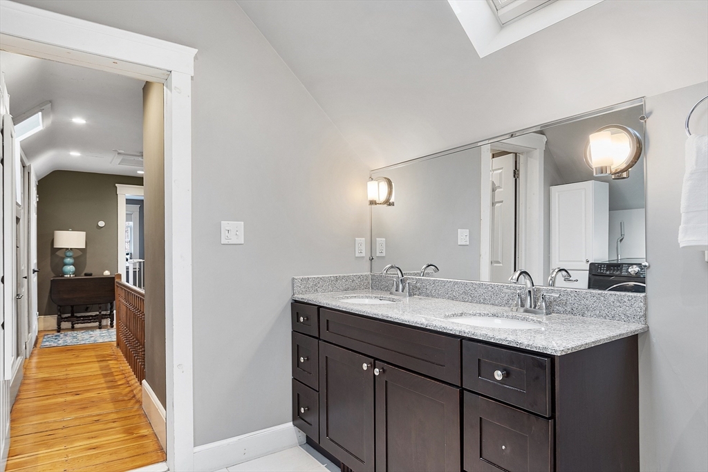 102 Centre Street Danvers, MA 01923 - Photo 16 of 36 a en suite bathroom with a sink and a mirror