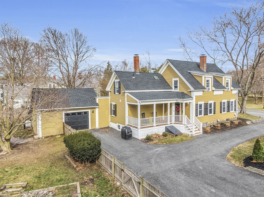 102 Centre Street Danvers, MA 01923 - Photo 25 of 36 a front view of a house with garden