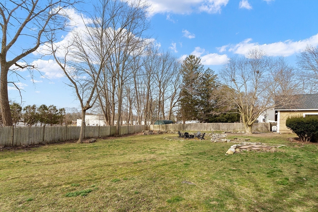 102 Centre Street Danvers, MA 01923 - Photo 26 of 36 a view of a yard with a house in the background