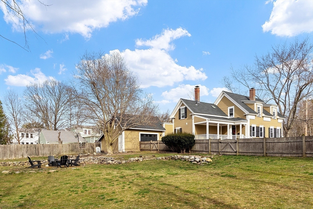 102 Centre Street Danvers, MA 01923 - Photo 27 of 36 a front view of a house with a yard swimming pool and outdoor seating