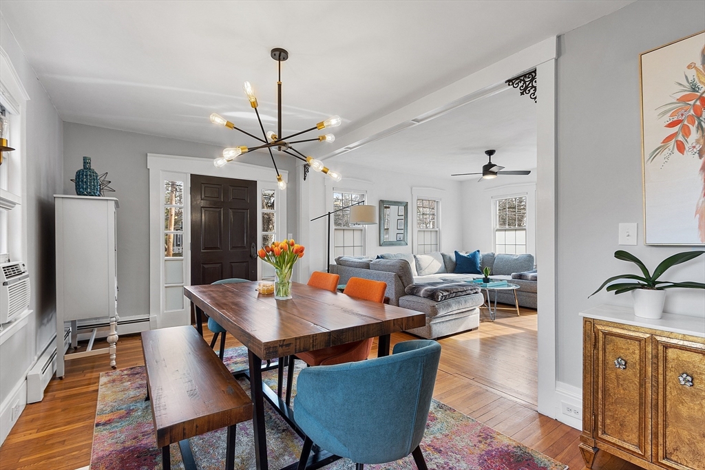 102 Centre Street Danvers, MA 01923 - Photo 4 of 36 a living room with dining table and a dining table with wooden floor