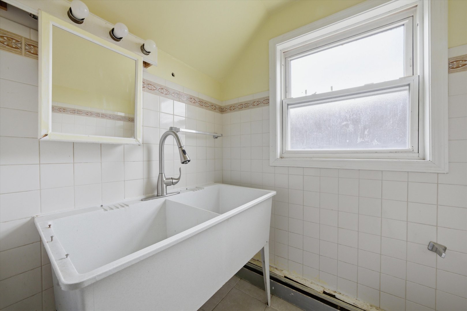3100 Clinton Avenue Berwyn, IL 60402 - Photo 16 of 25 a white bath tub sitting next to a window