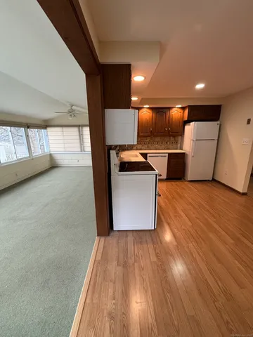 a view of a kitchen with a sink and microwave