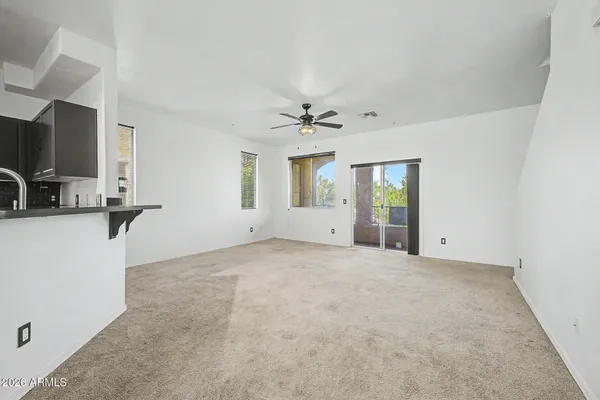 a view of an empty room with a window