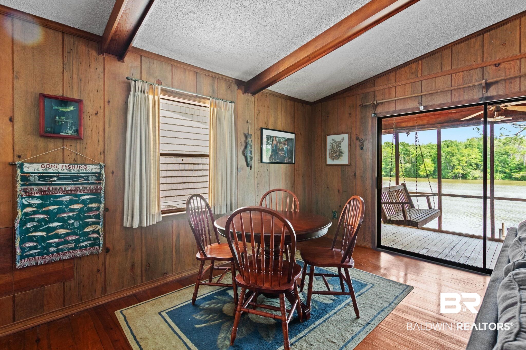 8153 Bryant's Lndg Road Stockton, AL 36579 - Photo 33 of 87 Wood-paneled room with exposed ceiling beams and wood-finish flooring