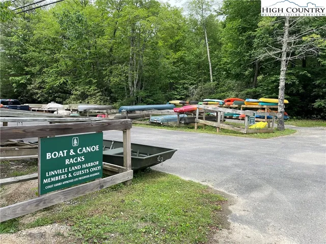 a view of swimming pool with sitting area and furniture