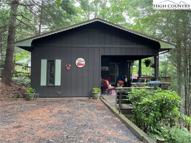 a view of house with backyard space and garden