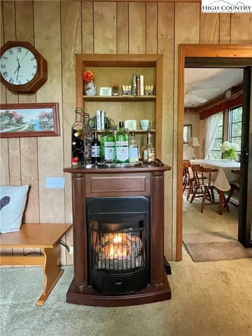 a living room with furniture a fireplace and a table