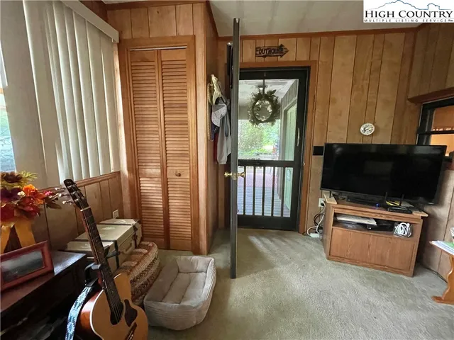 a room with furniture and a flat screen tv