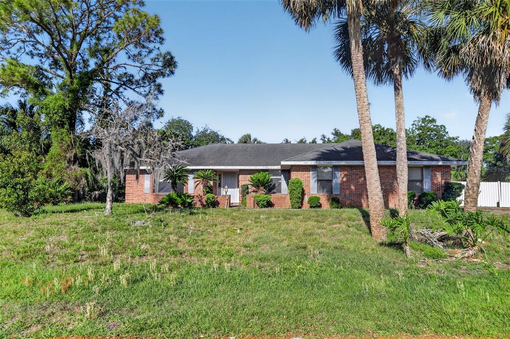 1620 Timbercrest Drive Deltona, FL 32738 - Photo 1 of 28 front view of a house with a garden