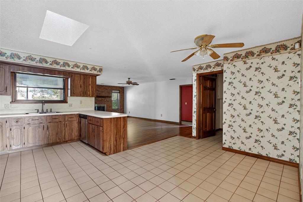 1620 Timbercrest Drive Deltona, FL 32738 - Photo 14 of 28 a kitchen with stainless steel appliances a sink and a refrigerator