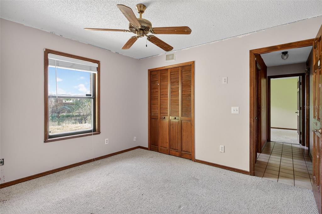 1620 Timbercrest Drive Deltona, FL 32738 - Photo 19 of 28 a view of an empty room with a window