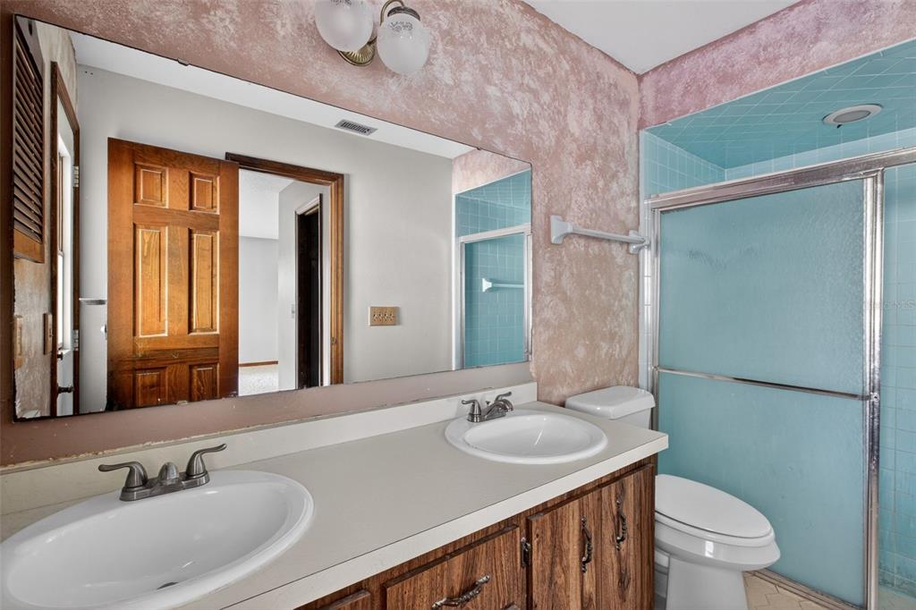 1620 Timbercrest Drive Deltona, FL 32738 - Photo 22 of 28 a bathroom with a granite countertop sink toilet and shower