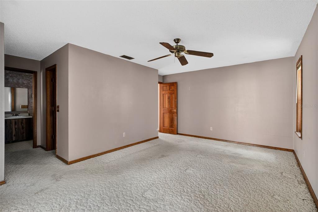 1620 Timbercrest Drive Deltona, FL 32738 - Photo 7 of 28 a view of a livingroom with a ceiling fan and entryway
