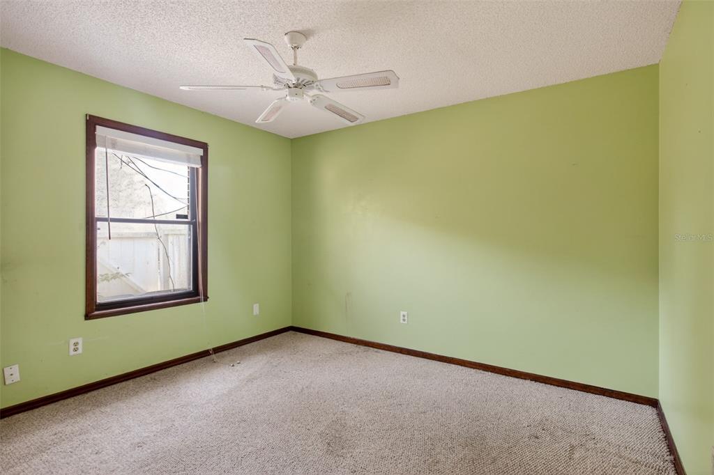 1620 Timbercrest Drive Deltona, FL 32738 - Photo 10 of 28 an empty room with windows and ceiling fan