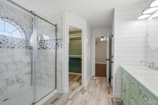 a bathroom with a sink and shower