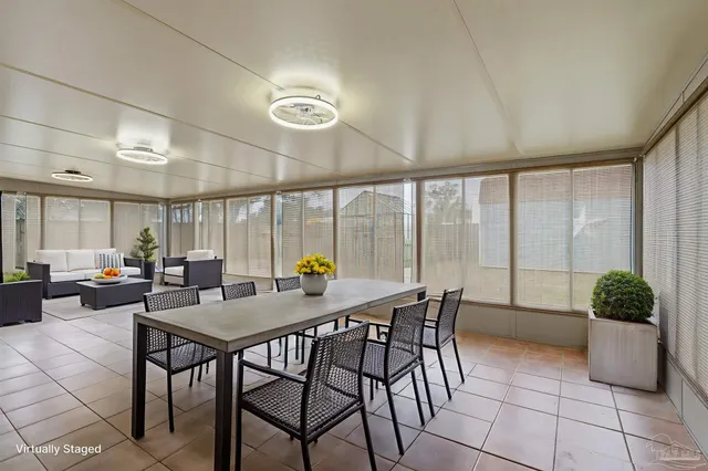 a view of a dining room with furniture window and outside view