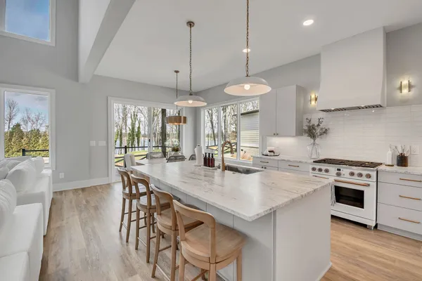 a kitchen with sink cabinets and wooden floor